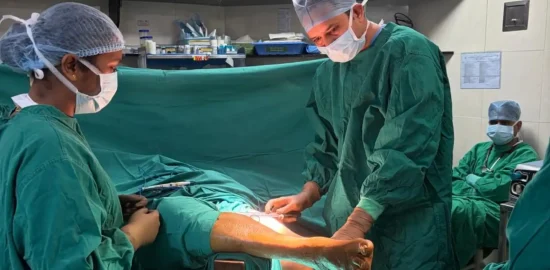 Dr. Vishal Patel with staff in a skin grafting surgery of leg.