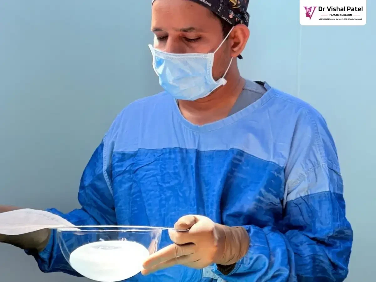 Dr. Vishal Patel unpacking breast implant cover.