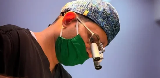 Dr. Vishal Patel wearing surgical binocular