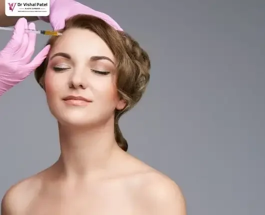 Botox being injected on forehead of women.