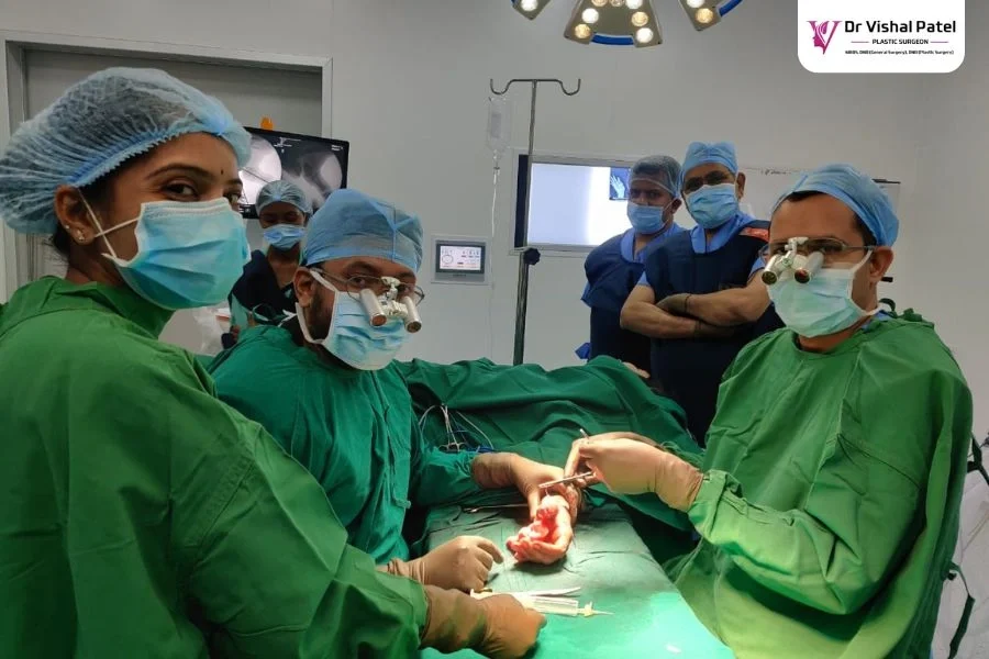 Dr. Vishal Patel - Best Plastic Surgeon in Mumbai Performing Surgery on Hand