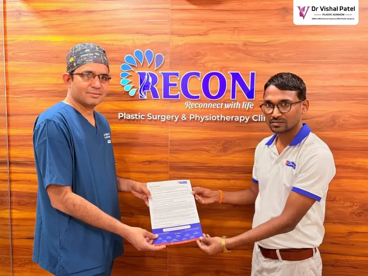 Dr. Vishal Patel with GMoney representative at his clinic.