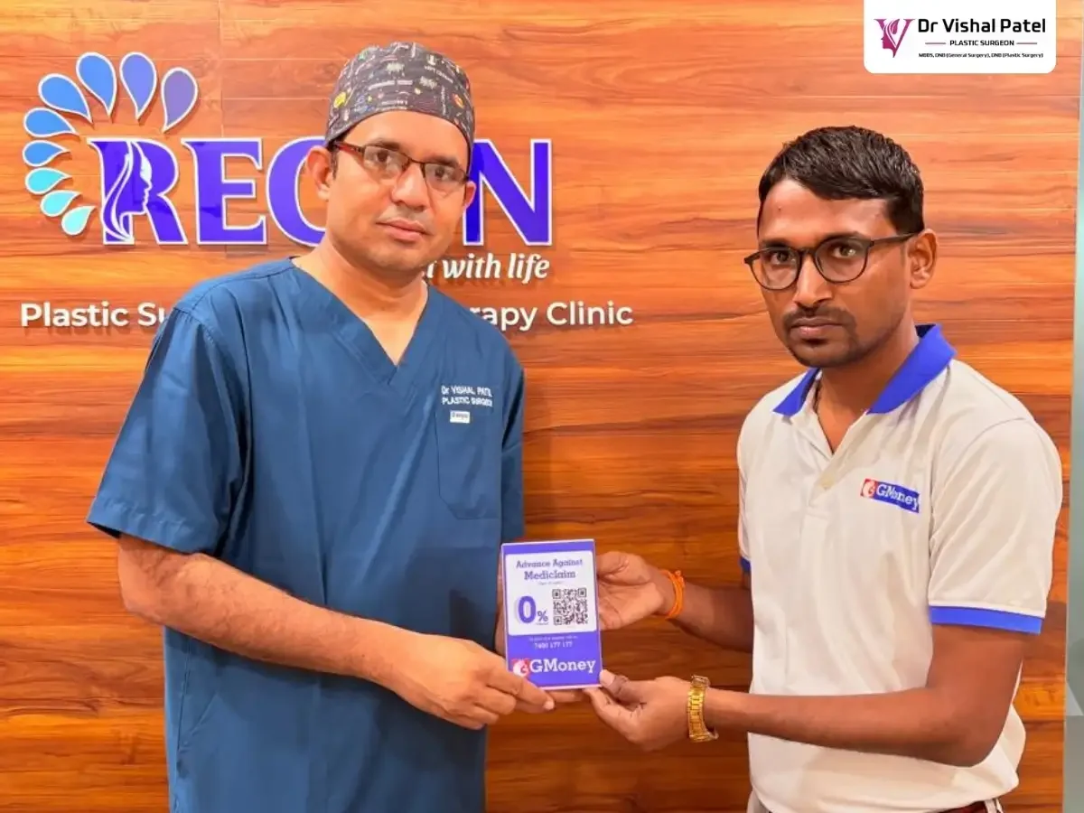 Gmoney representative giving GMoney QR code to Dr. Vishal Patel
