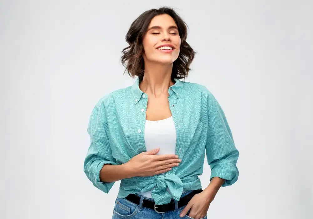 A happy women after a Tummy tuck operation