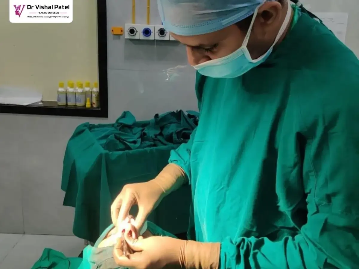 Nose tip plasty surgeon Dr. Vishal Patel performing tip refinement surgery in Mumbai.