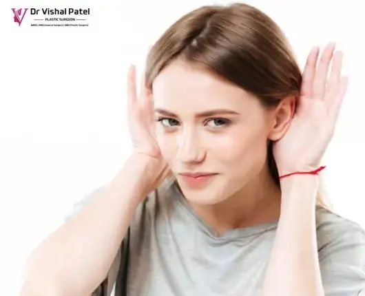 What is Otoplasty or Ear Shape Correction Surgery – Dr. Vishal Patel Explains An Women showing her protruding ears